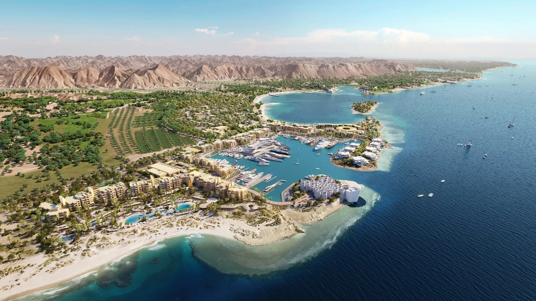 Four Seasons Amaala on the Red Sea coast, a marina and low white buildings against the mountains