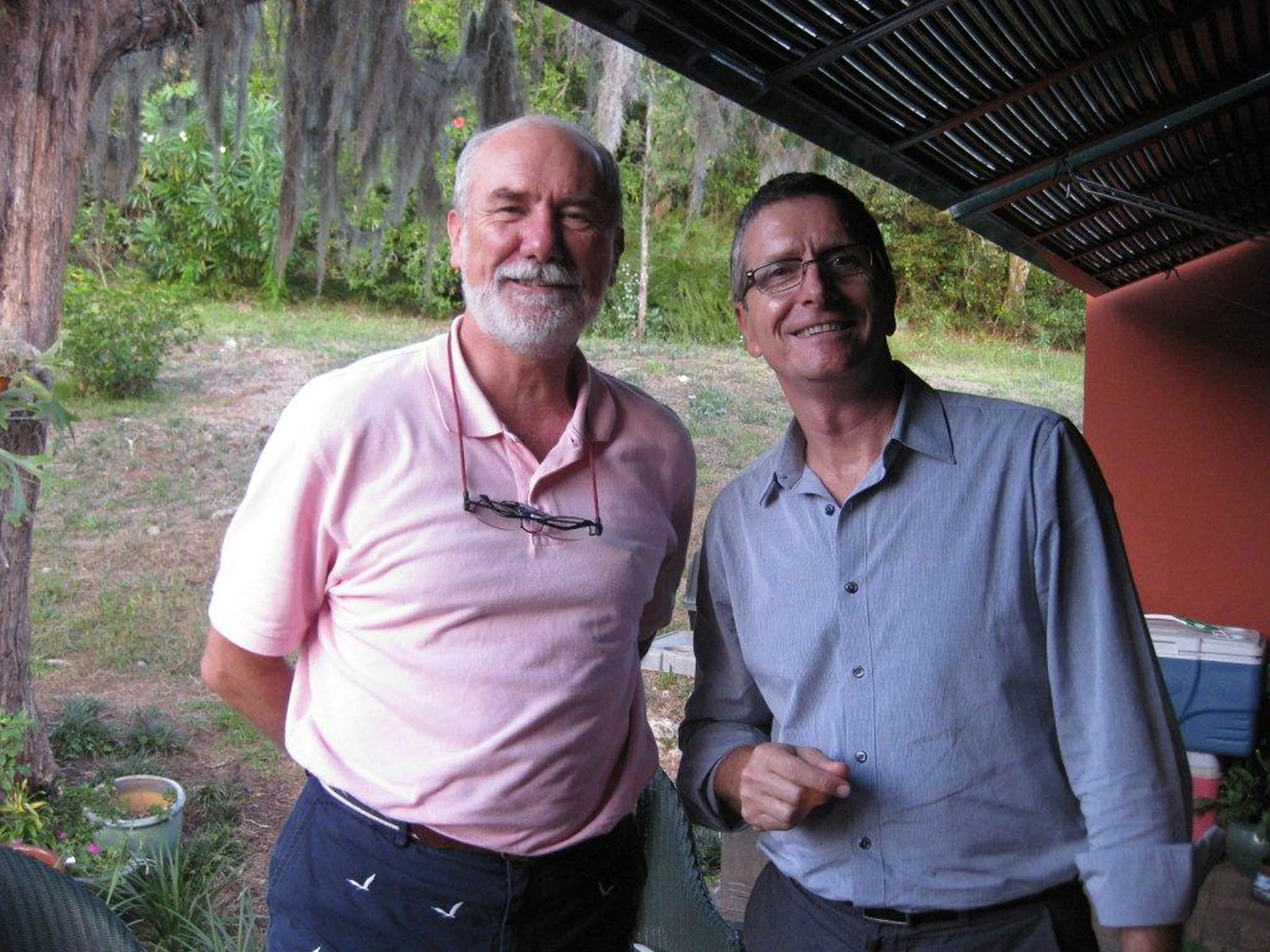 Collin Campbell and Tim Peck side by side under a pergola, 2011