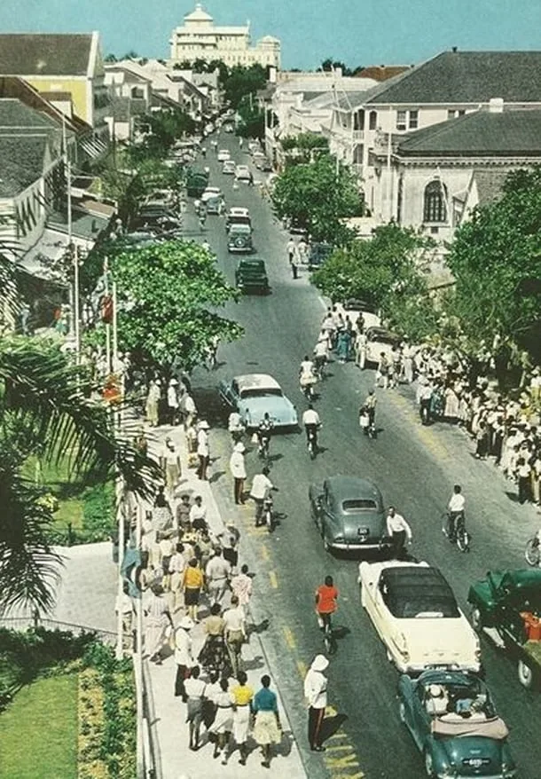 Front Street, Hamilton, lined with cars and cyclists