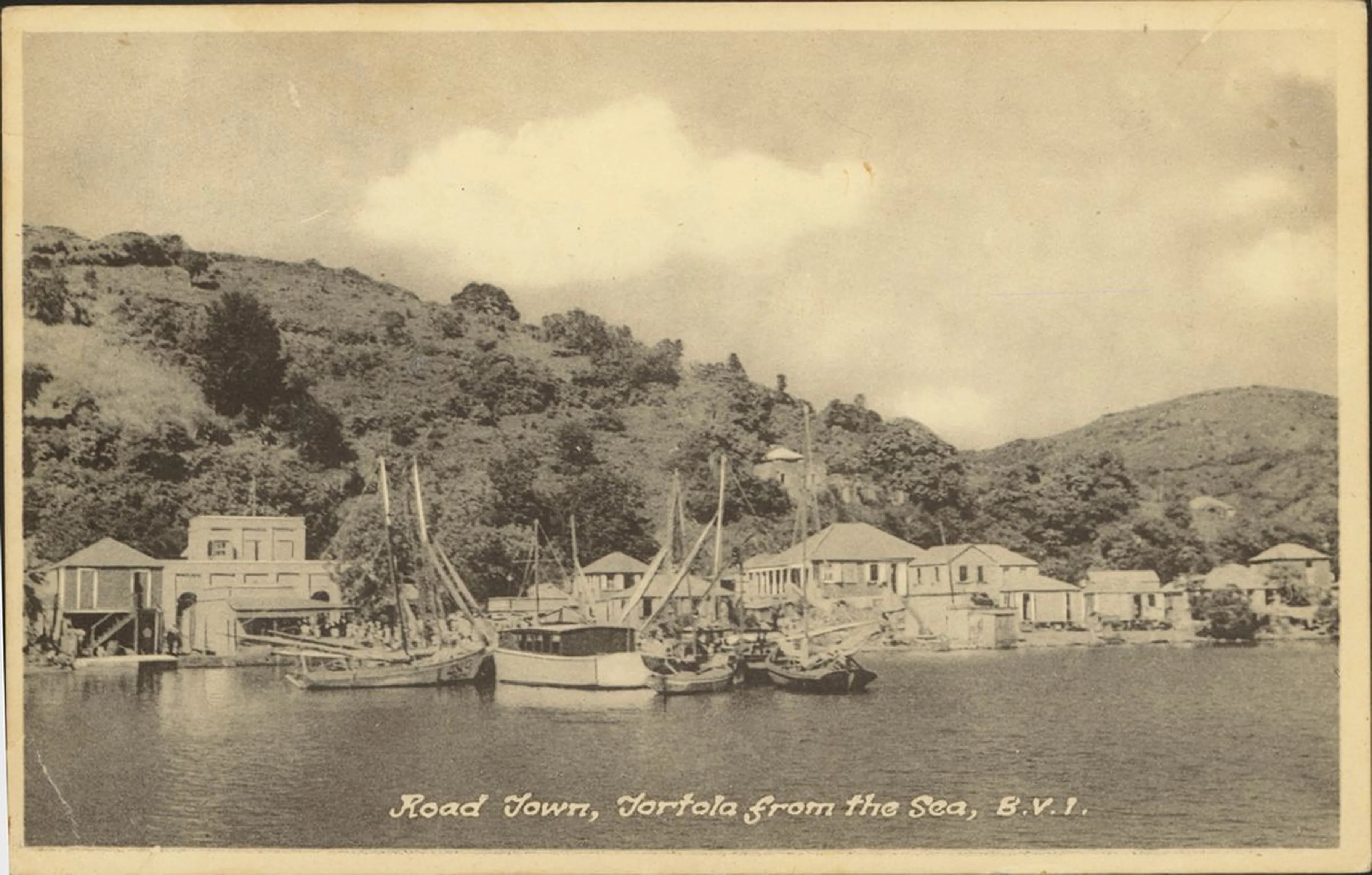 Sepia postcard — “Road Town, Tortola from the Sea, B.V.I.” — fishing boats moored below the hillside