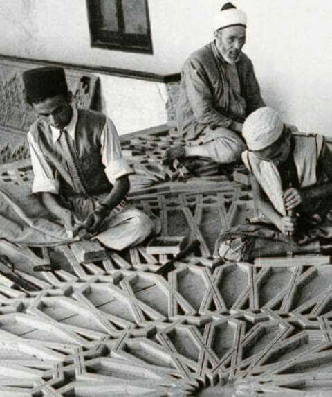 Three man assembling tilework