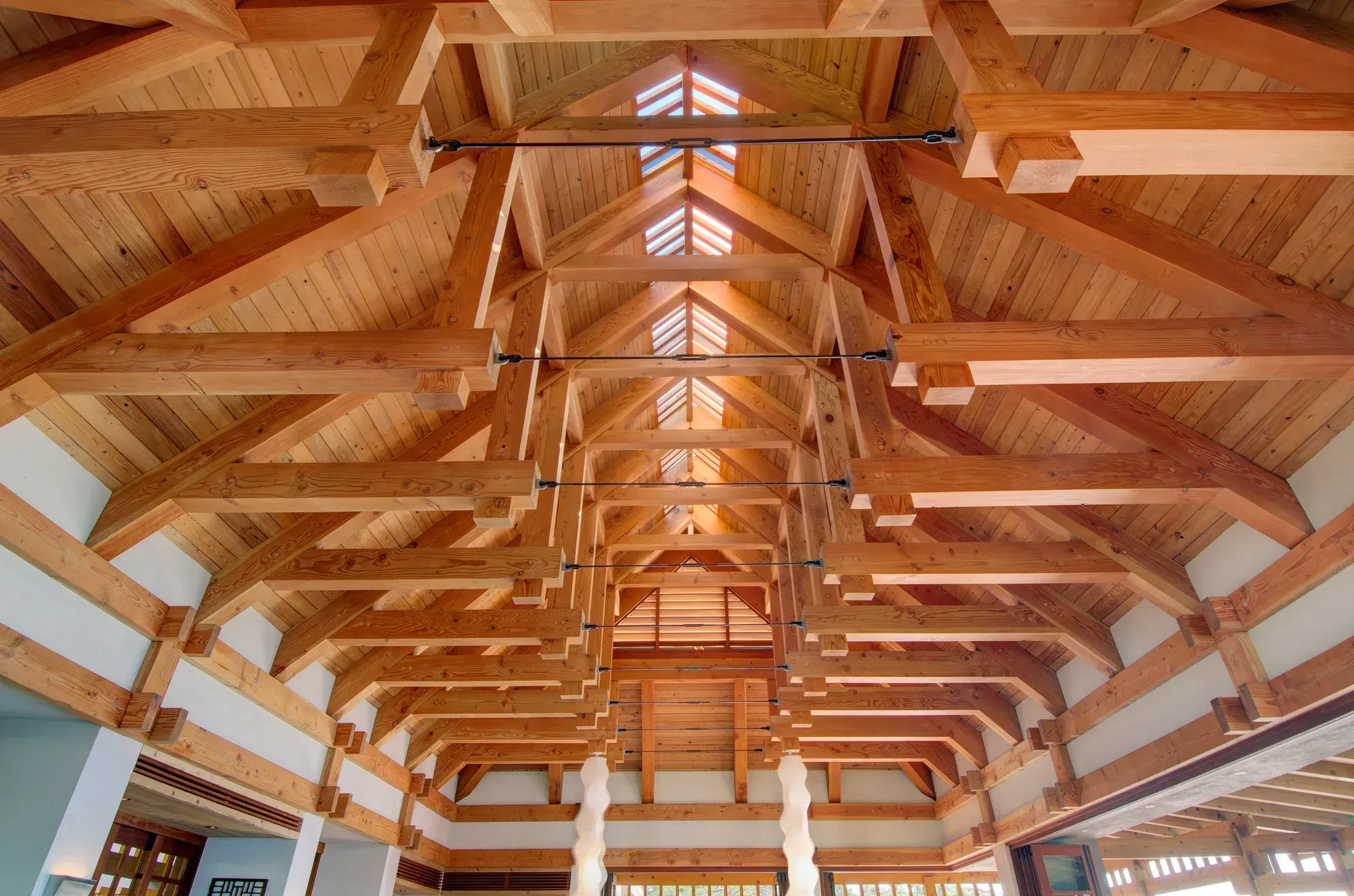 The cathedral ceiling of exposed timber beams and steel ties, a clerestory at the ridge