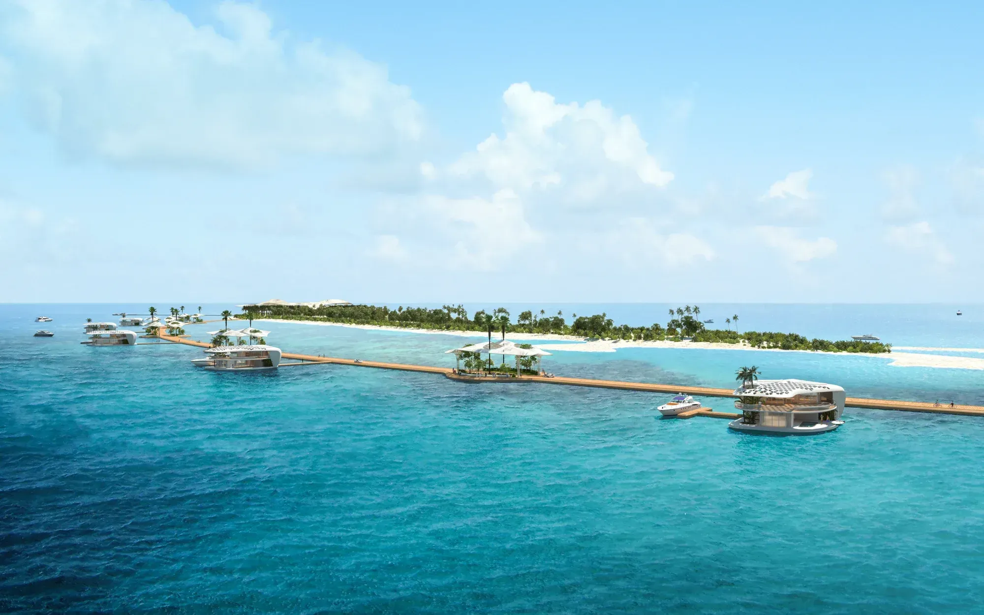Villas on the water along a boardwalk out from the island, the reef around them