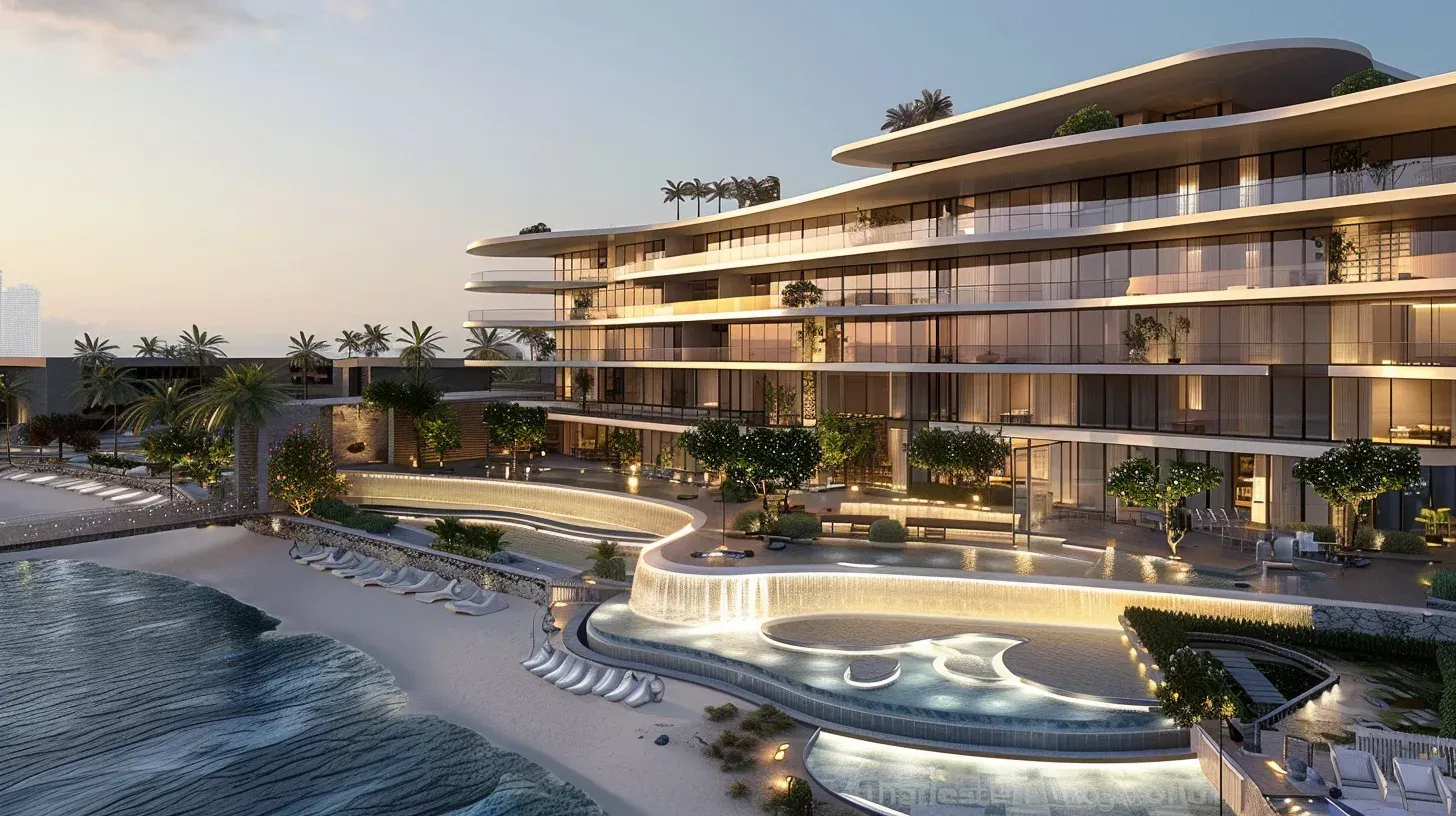 A curved hotel lit at dusk, its terraces stepping down to a lagoon pool on the beach
