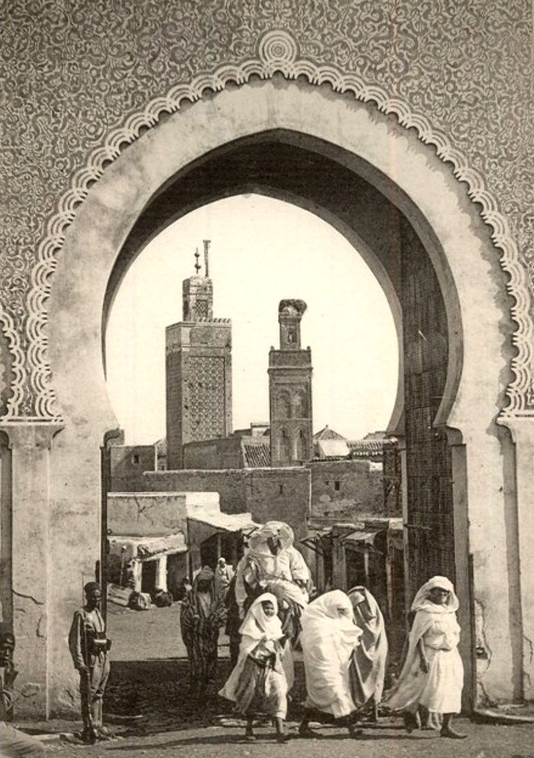 Sepia photograph of a monumental gate on Morocco