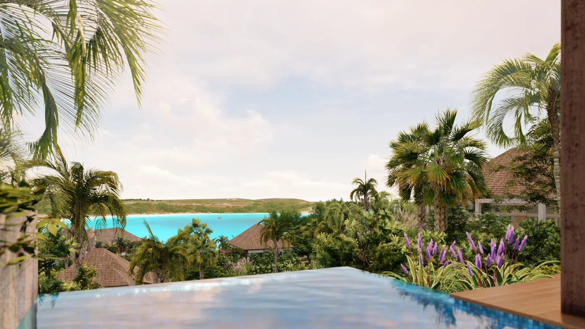 An infinity pool between palms, the turquoise bay and its beach beyond