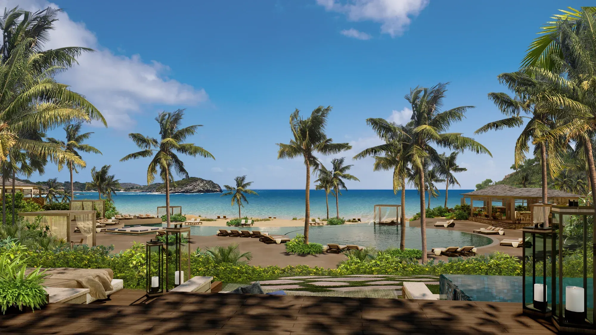 The main pool under palms, loungers and a pavilion, the beach and the sea beyond