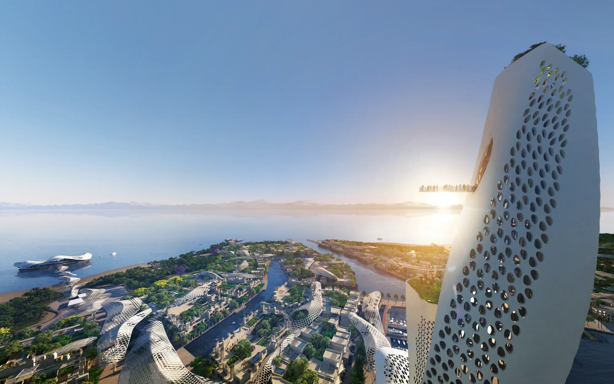 A perforated tower close up at sunrise, the villages and lagoons below, mountains across the water
