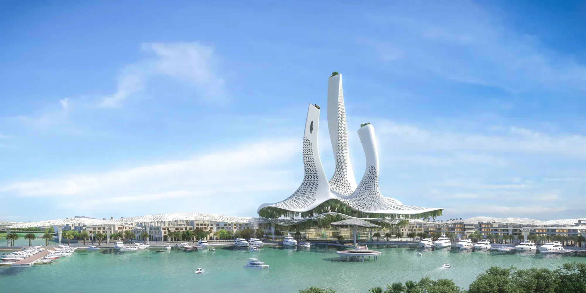 Three white perforated towers rising from a canopy over a marina, low white buildings along the water