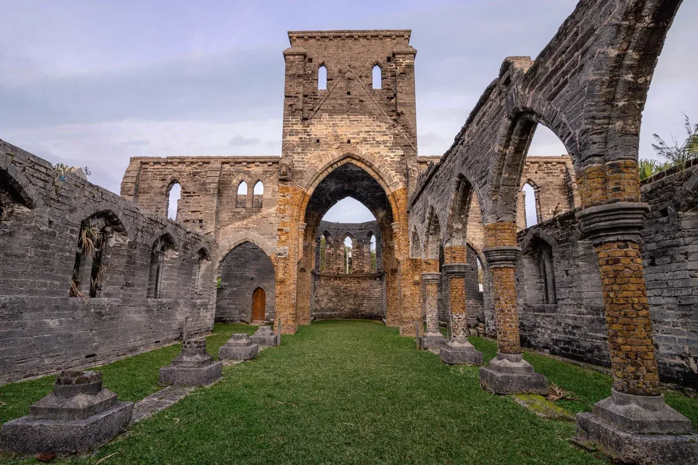 The roofless Gothic arches of the Unfinished Church, grass for a floor